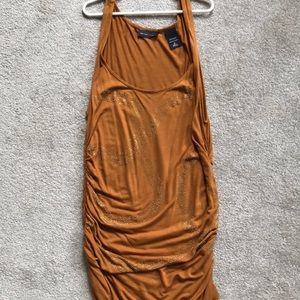 Beautiful, modestly beaded, dark mustard top. NWOT